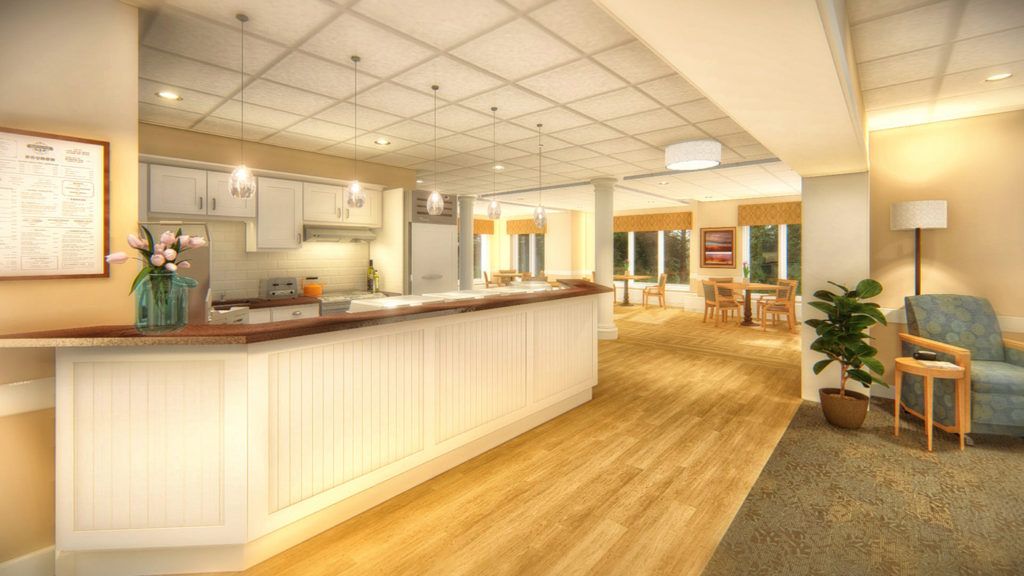 A spacious and modern kitchen with a large countertop, wood flooring, and stylish lighting.