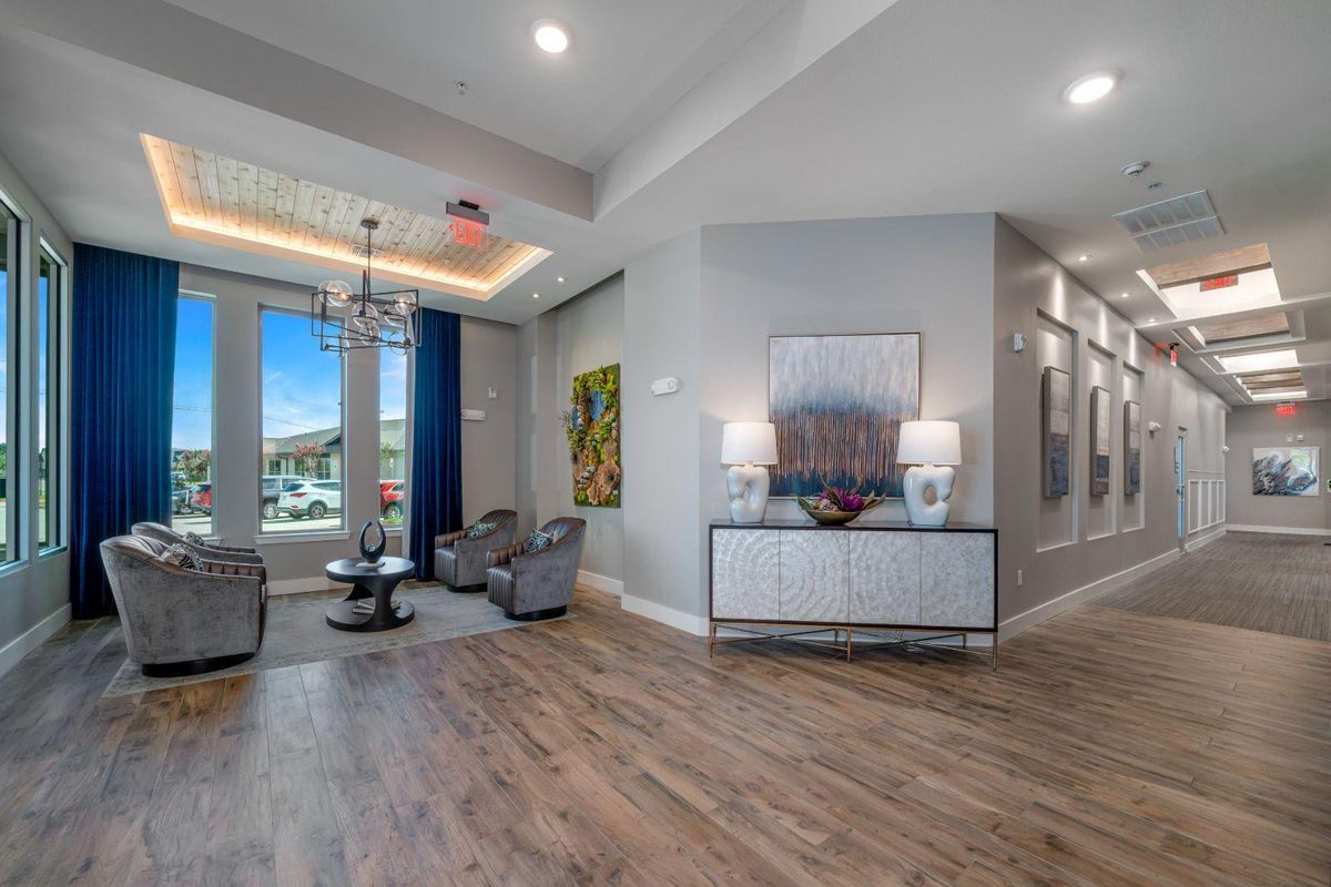 A modern living room with contemporary decor and abundant natural light.