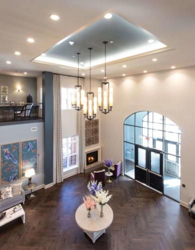 Spacious modern lobby with elegant chandeliers and stylish interior design.