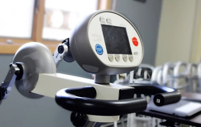 A close-up view of a stationary bike console in a gym.