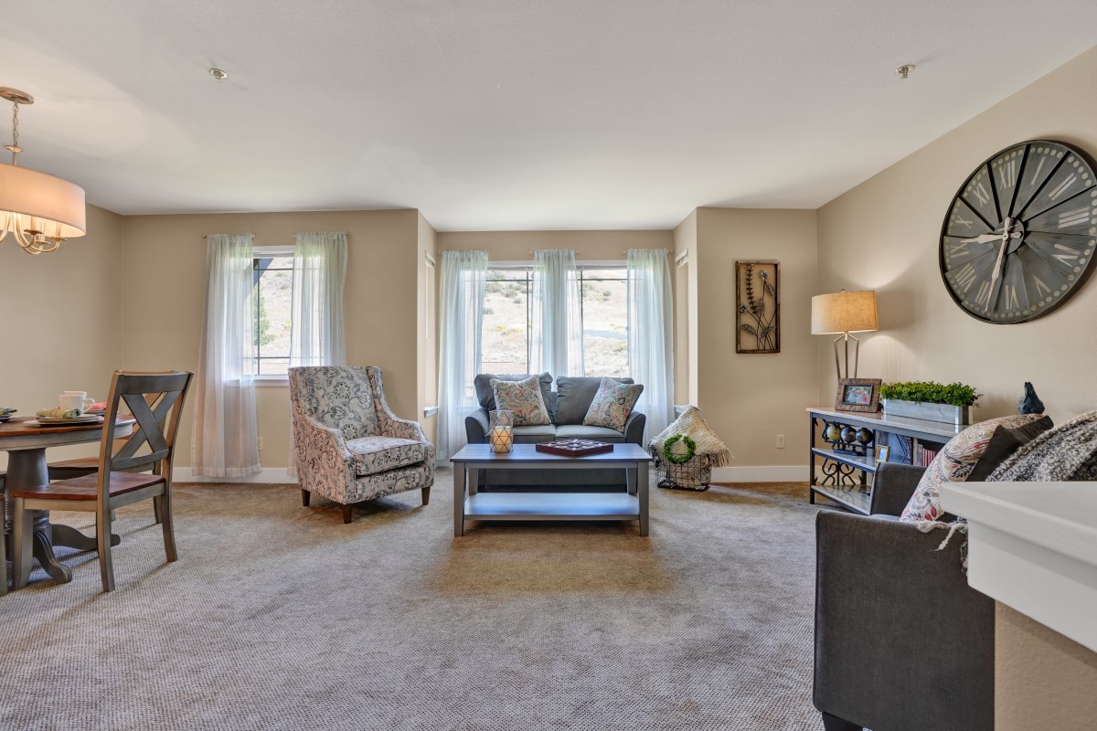 A cozy living room with comfortable seating and soft lighting.