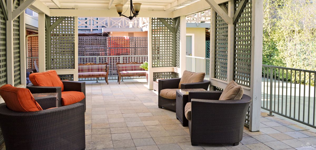 A cozy outdoor patio with comfortable seating, perfect for relaxation.