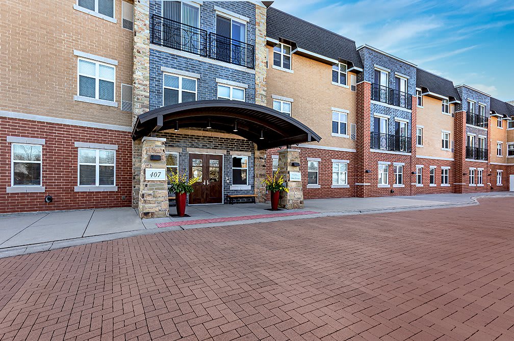 Front view of a modern hotel entrance with brick facade.
