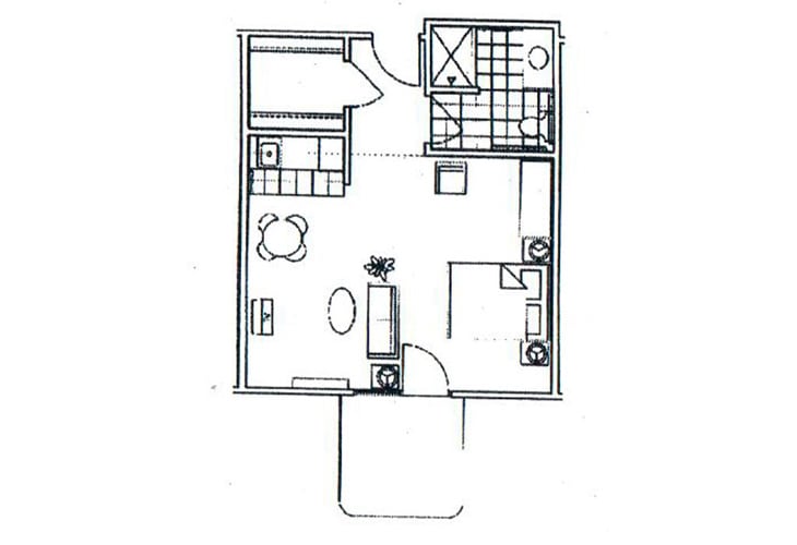 A floor plan of a one-bedroom apartment showcasing the layout of rooms and furniture placement.