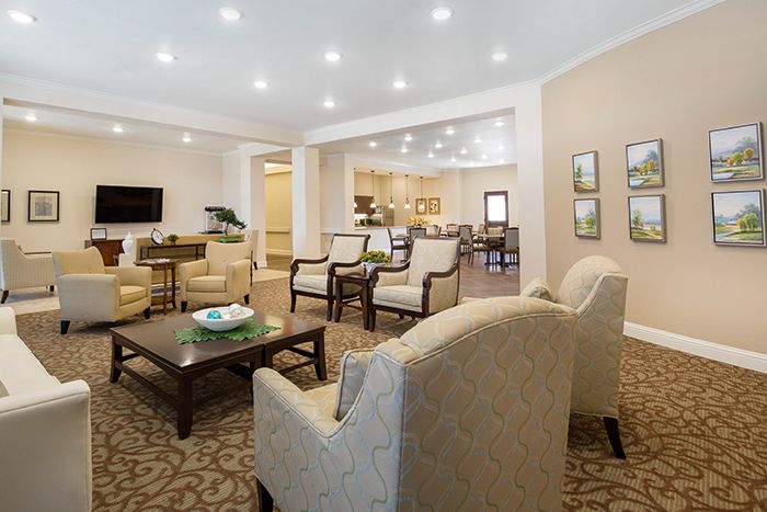 A spacious and elegantly designed living room with comfortable seating and modern decor.