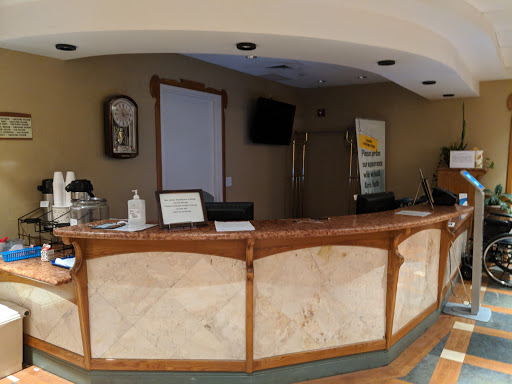 A view of a hotel reception area with a stylish counter.