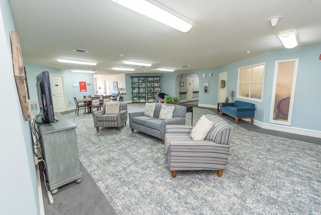 A spacious and modern lounge area with comfortable seating and stylish decorations.