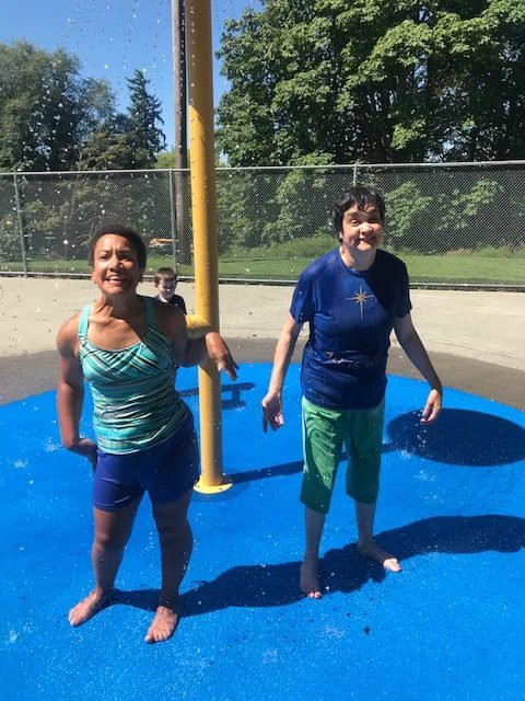 Children enjoying a sunny day at the water park, splashing and playing in the fountains.