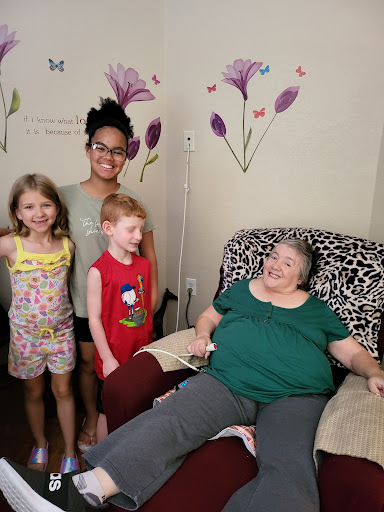 A joyful family moment with kids and their grandmother.