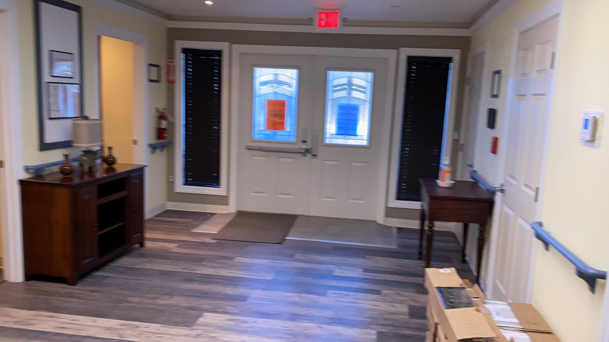 A well-lit entrance area with double doors and a visible exit sign.