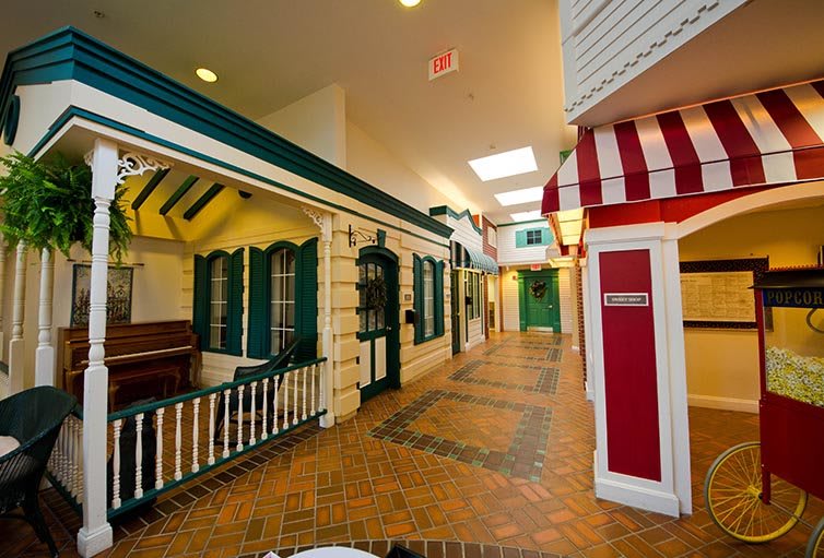 A vibrant indoor hallway designed to resemble a charming village street.