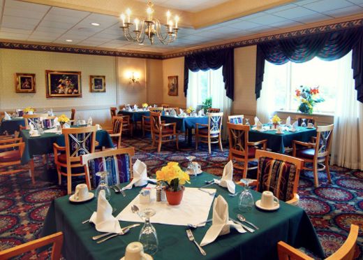 A well-decorated restaurant dining room with tables set for guests.