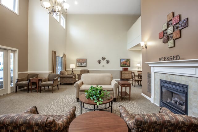 A cozy living room with elegant furniture and a fireplace.