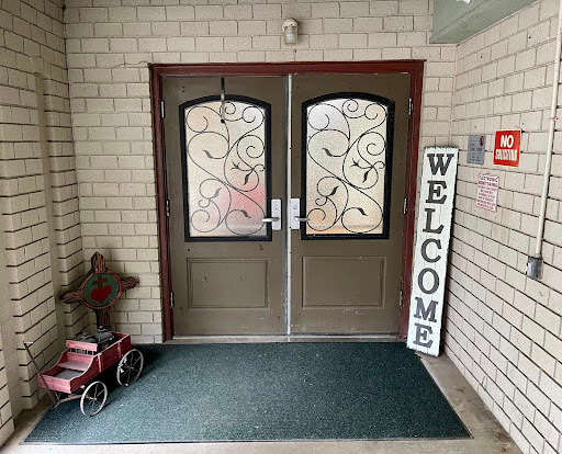Welcoming entrance with decorative doors and a prominent welcome sign.