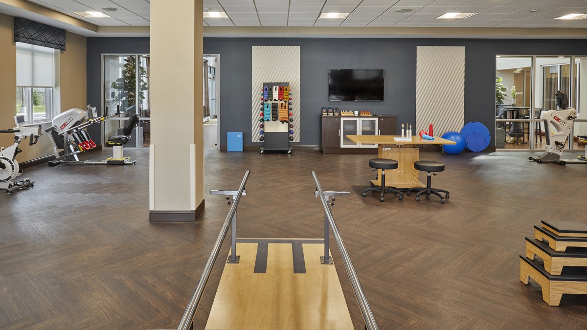 A modern rehabilitation center featuring exercise equipment and training areas.