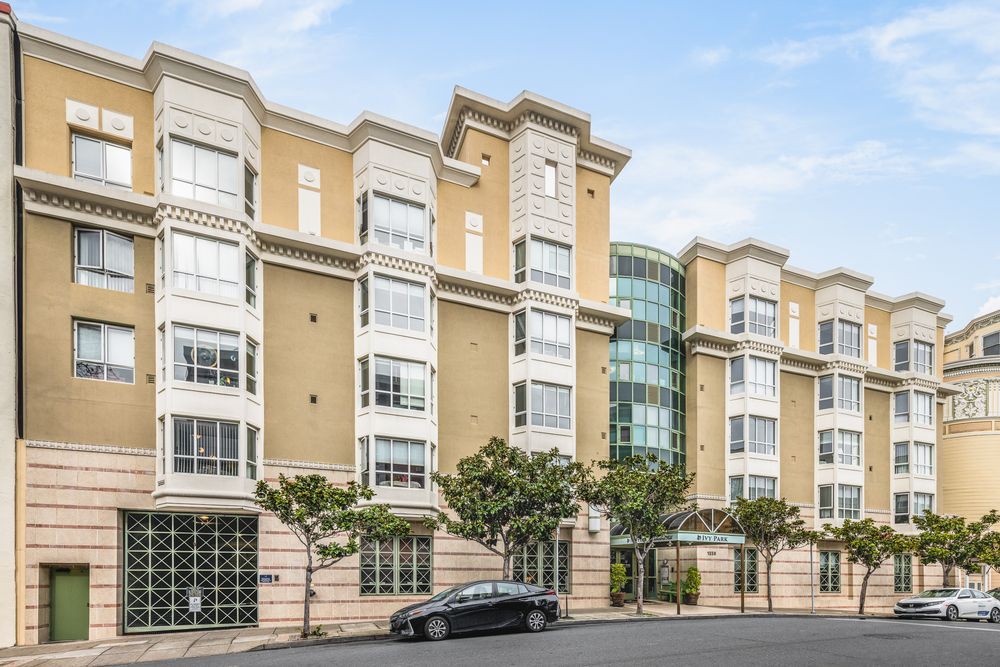 A modern residential apartment building in an urban setting.