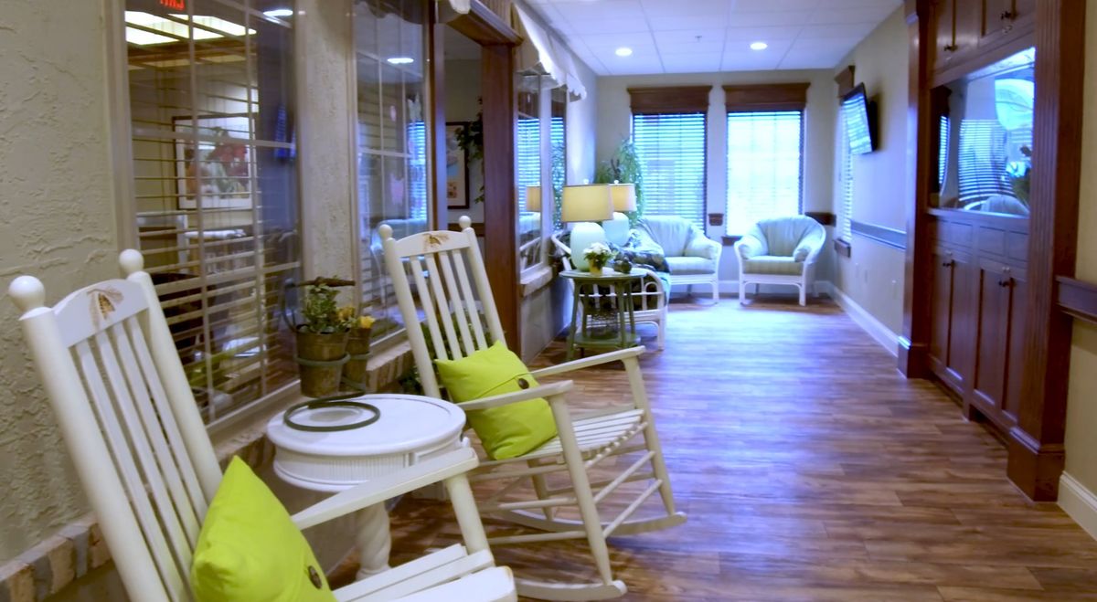 A cozy lounge area with rocking chairs and soft cushions, perfect for relaxation.