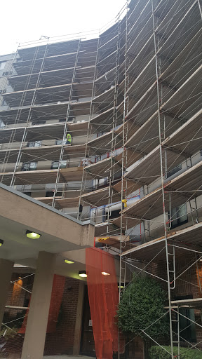 Scaffolding set up around a building undergoing renovation.