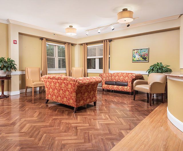 A cozy living room with comfortable seating and hardwood flooring.