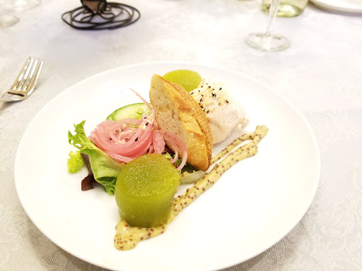 An artfully presented gourmet seafood dish featuring fresh ingredients and vibrant colors.