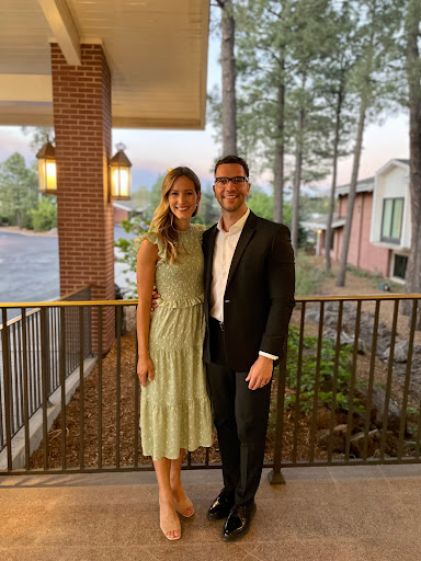 A lovely couple enjoying a beautiful evening outdoors.