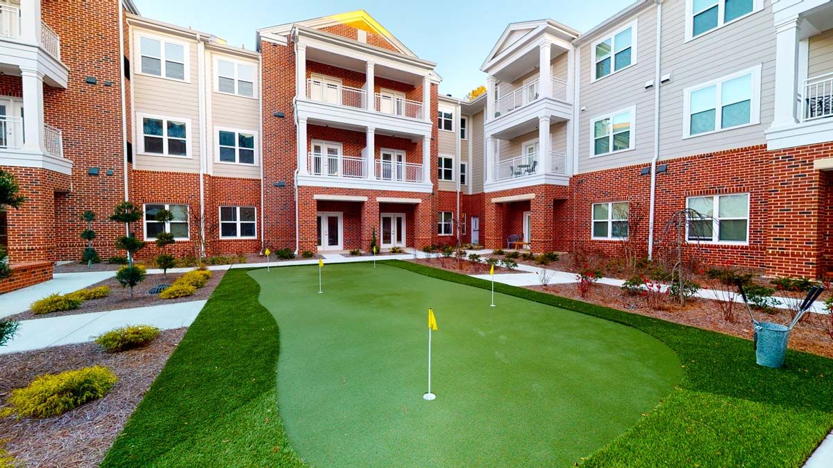 Apartment complex with a mini-golf putting green.