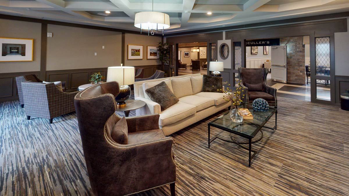 A cozy living room with elegant furniture and warm lighting.
