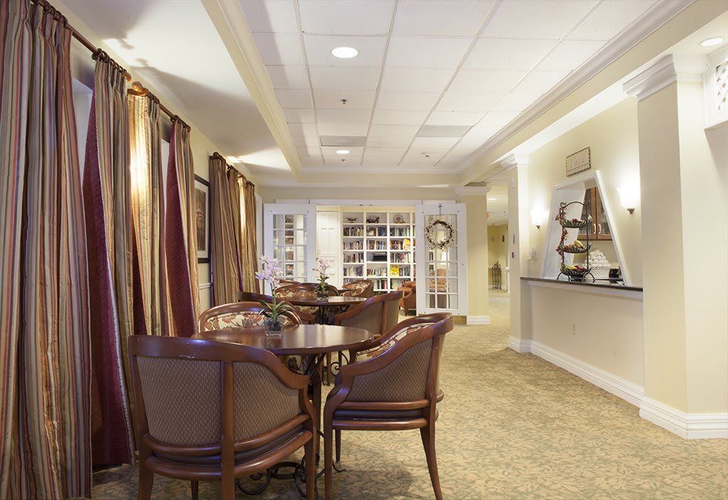 A cozy lounge area with elegant furniture and soft lighting.