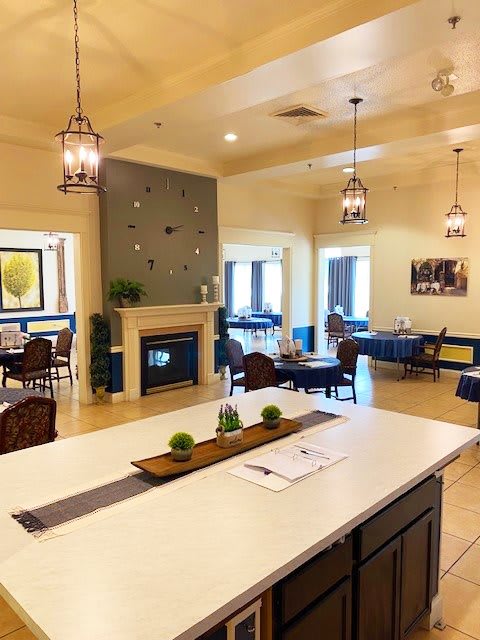 A modern dining area with a fireplace and elegant decor.