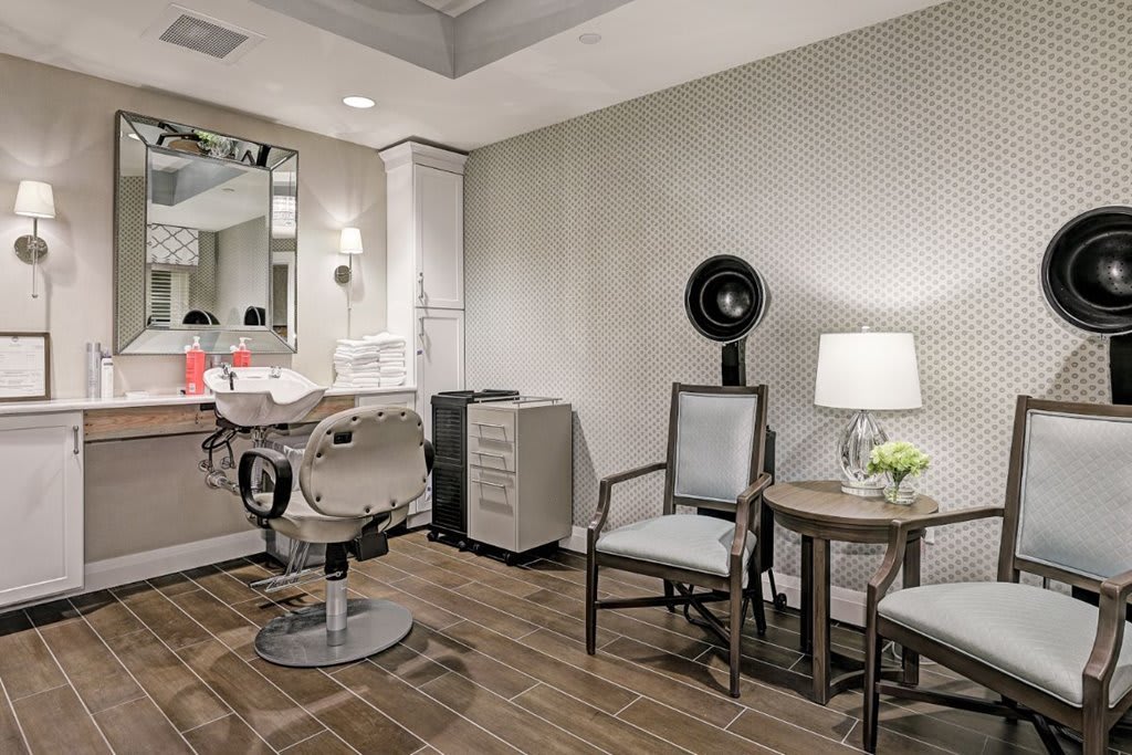 A modern salon interior featuring stylish furniture and decor.