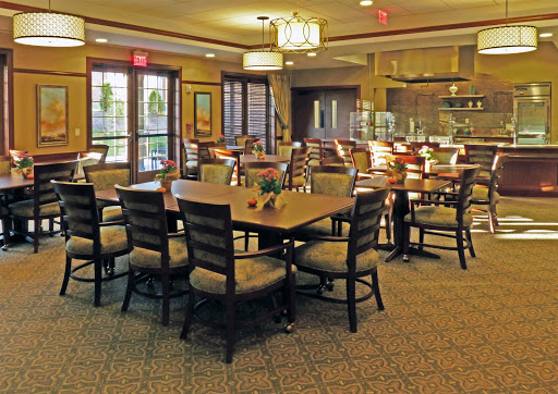 A warm and inviting dining area with wooden tables and comfortable chairs, perfect for casual meals.