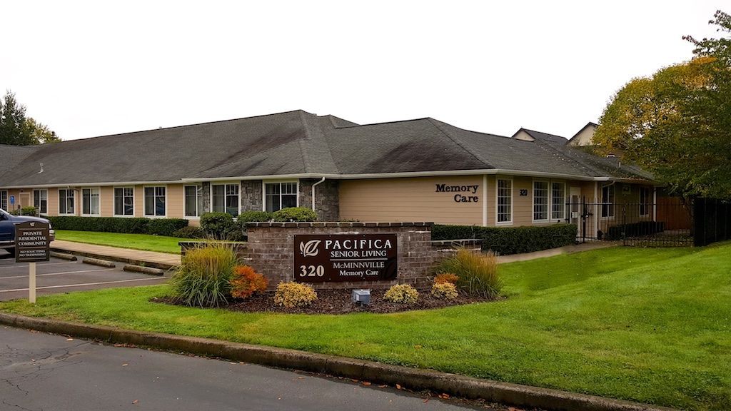 Exterior of a healthcare clinic with a sign reading 'Pacific Eye Clinic'.
