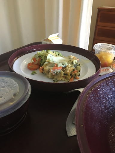 A colorful and healthy meal served on a plate, accompanied by a dessert.