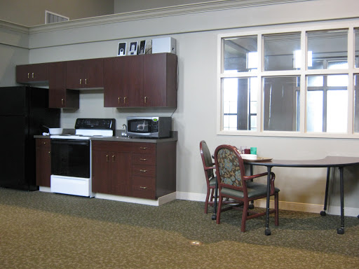 A cozy kitchen and dining area featuring modern appliances and furniture.