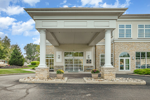A welcoming entrance to a hotel, featuring elegant architecture and landscaped surroundings.
