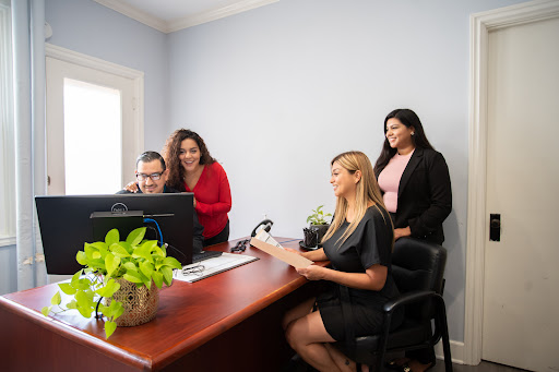 A group of professionals collaborating in a modern office environment.