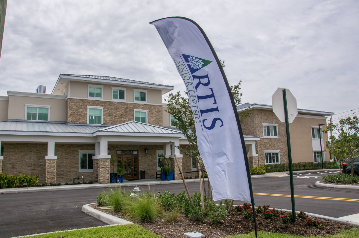 A building with an 'Artis' banner displayed in front.