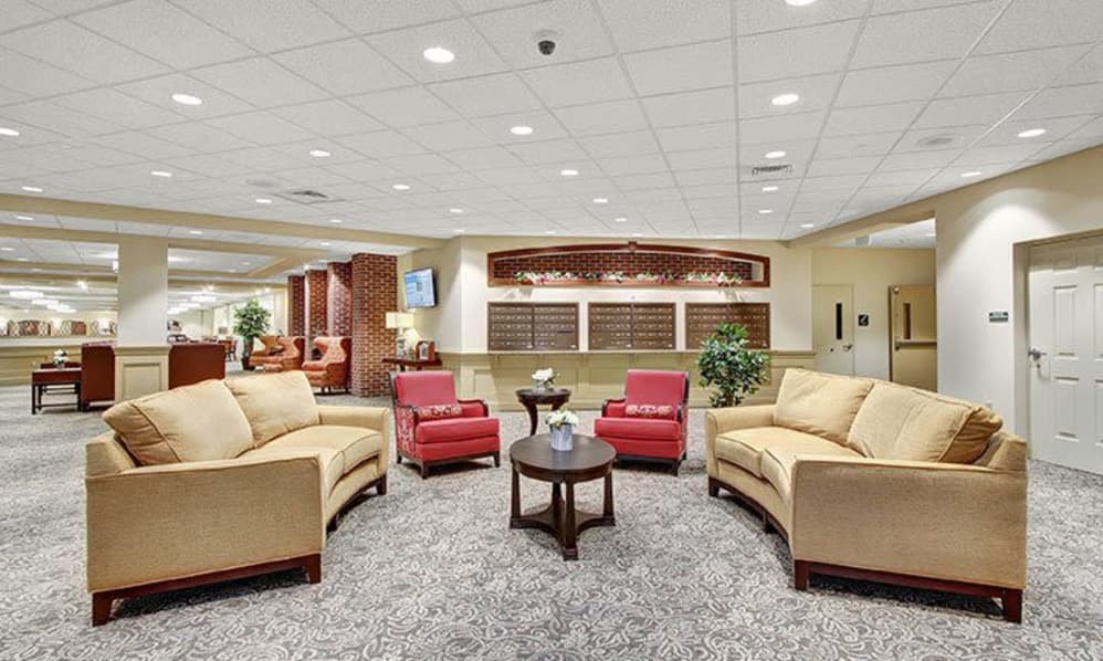 A modern lobby with comfortable seating and warm lighting.