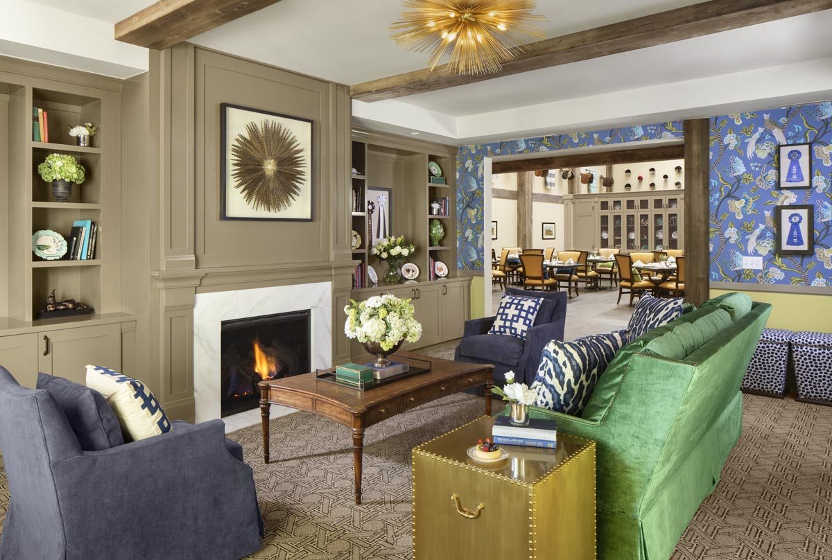 A stylish and cozy living room with a modern design, featuring a fireplace and elegant decor.