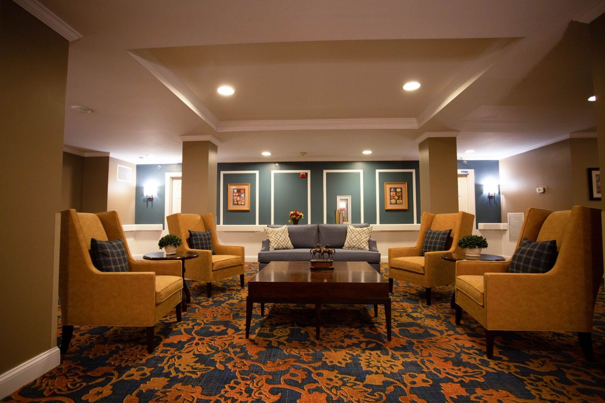 A cozy lobby area with comfortable seating and elegant lighting.