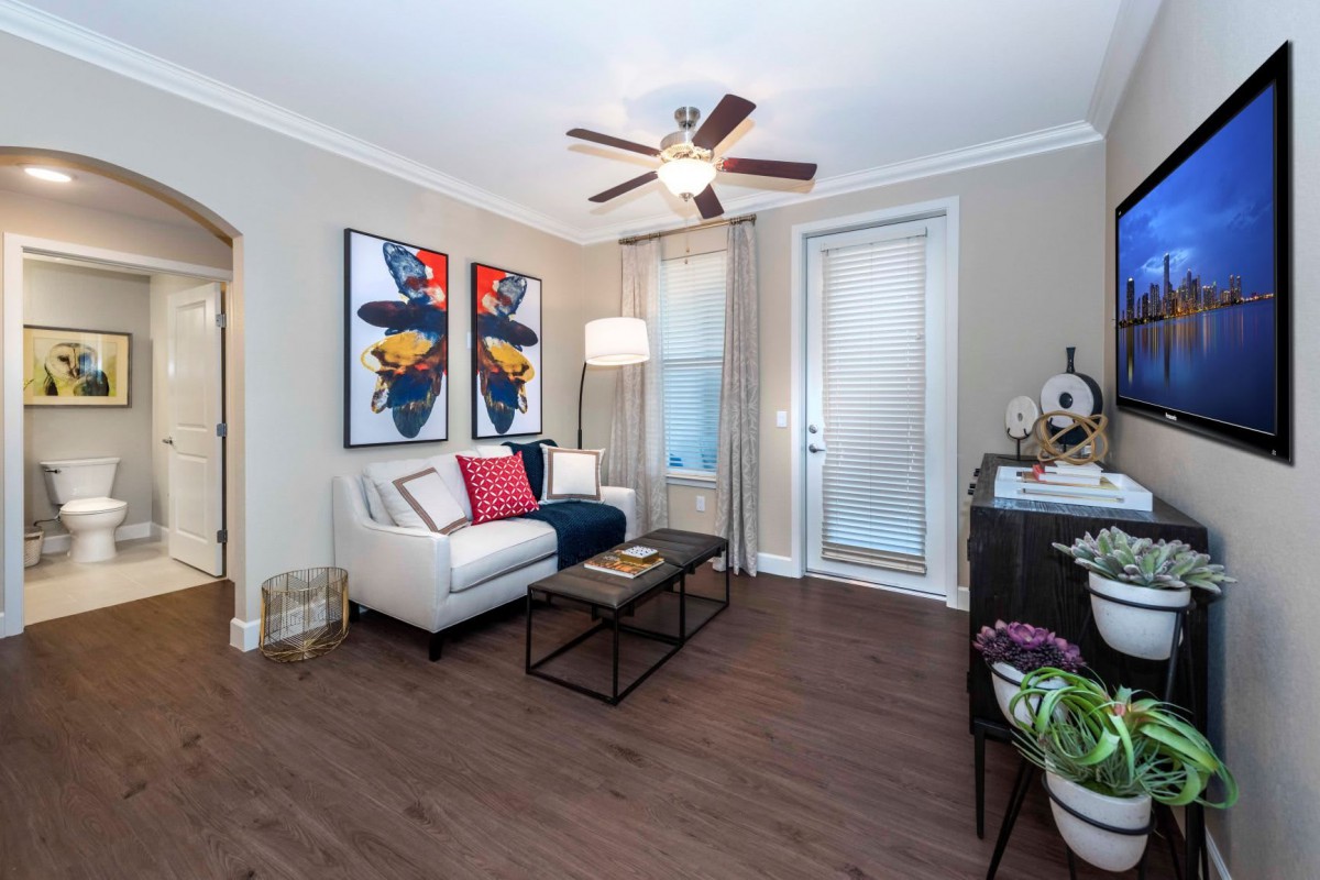 A modern living room with contemporary artwork, a comfortable sofa, and stylish decor.