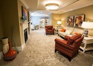 A cozy living room with comfortable seating and warm lighting.