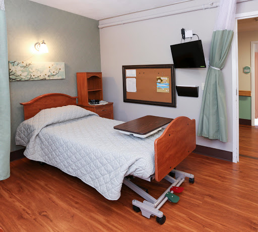 A well-equipped hospital patient room designed for comfort and accessibility.