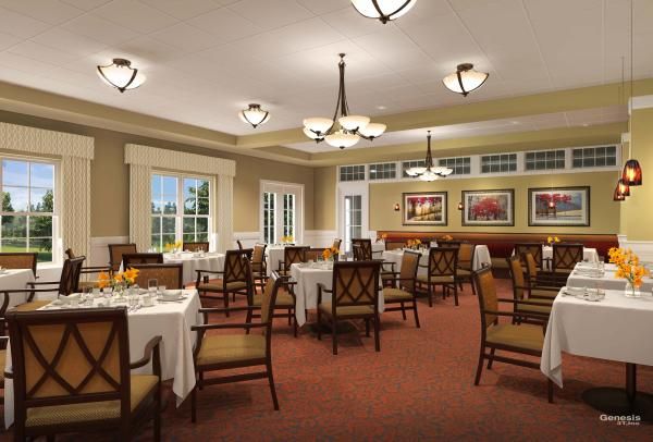 An elegant dining room with neatly arranged tables and chairs, featuring decorative chandeliers and artwork on the walls.