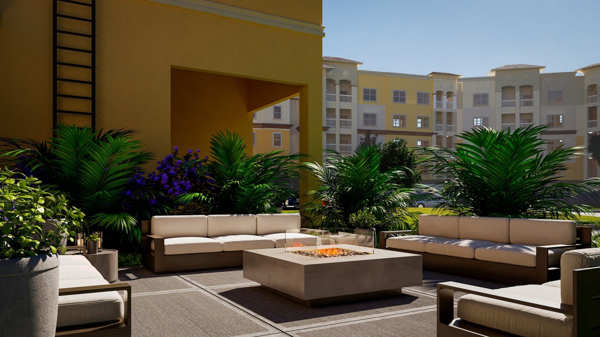A modern outdoor patio with comfortable seating and a central fire pit surrounded by lush plants.