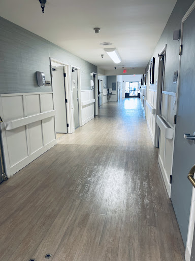A bright and clean hallway in a hospital setting.