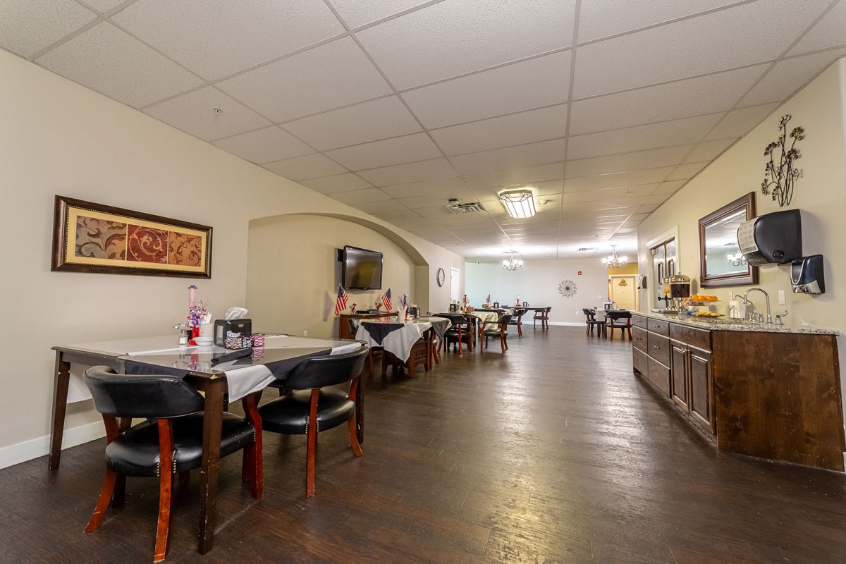 A spacious restaurant dining area with neatly arranged tables and chairs.