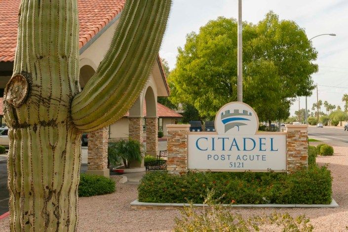Entrance view of Citadel with a cactus in the foreground.