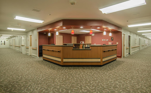 A modern reception area with warm lighting and stylish furniture.