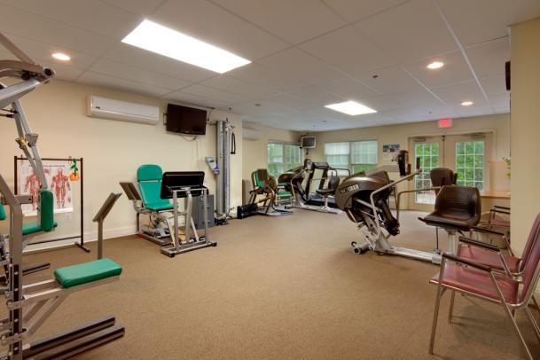 A well-equipped gym with various exercise machines.
